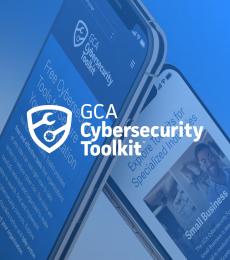 In white, a shield with the two opposite ends of wrenches stretching across it diagonally, next to the words "GCA Cybersecurity Toolkit" over a blue-tinted background of two phone screens displaying pages from the toolkit