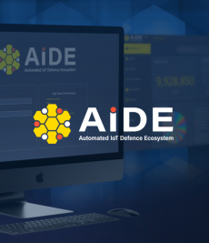 a logo made of six yellow hexagons surrounding one yellow hexagon with alternating red and white circles between the outer hexagonsto the right, in white, the acronym "AIDE" with an orange dot over the "i" underneath, in a smaller type, the words "Automated IoT Defence Ecosystem", the background is tinted blue and shows a desktop computer monitor with AIDE on the screen
